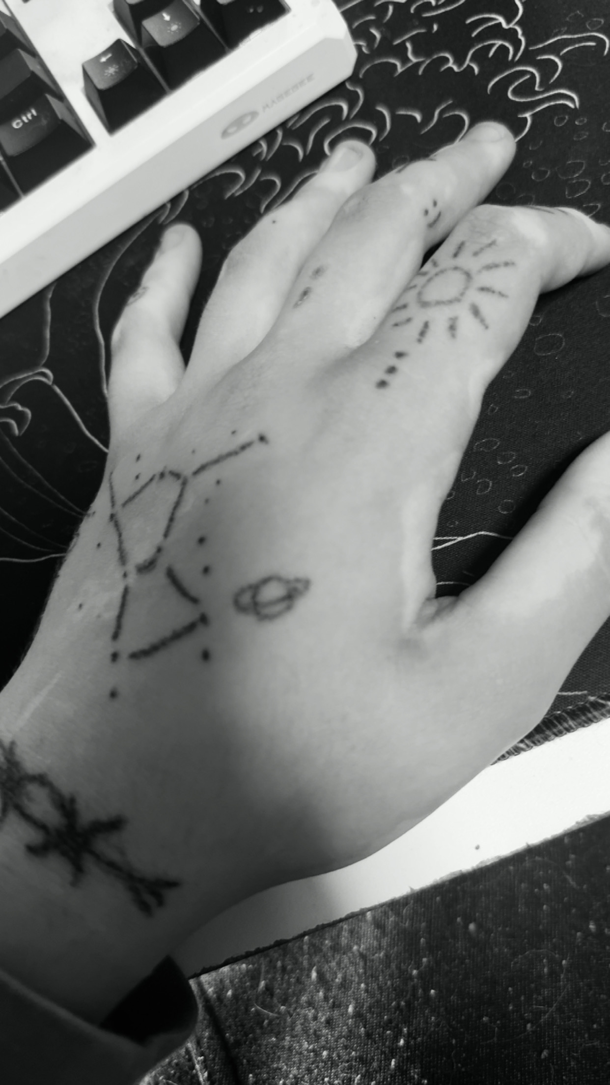 Black and white LIMPnK hand tattoo detail photo